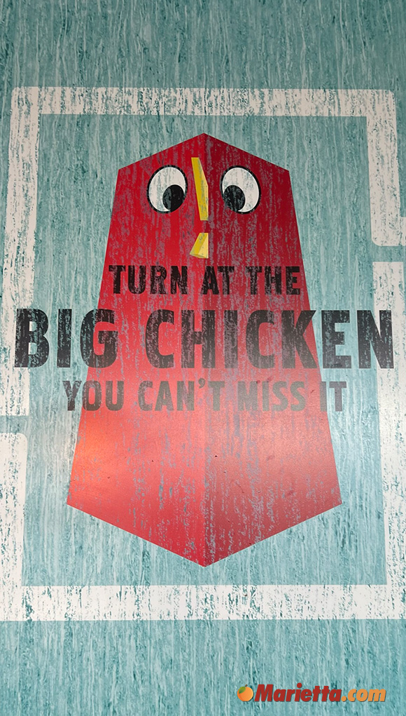 "Turn at the Big Chicken, you can't miss it" Sign